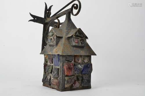 An early 20th Century cast metal lantern, with end of day or slag type glass insets, 37cm x 26cm