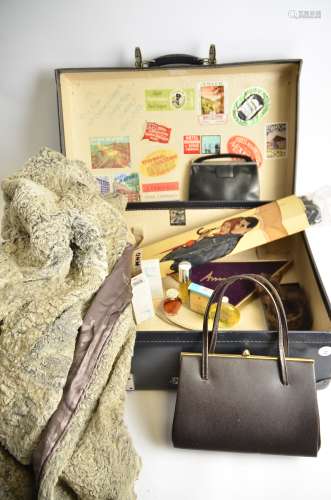 A vintage travel trunk, containing various vintage perfumes, toiletries, and human hair (10+)