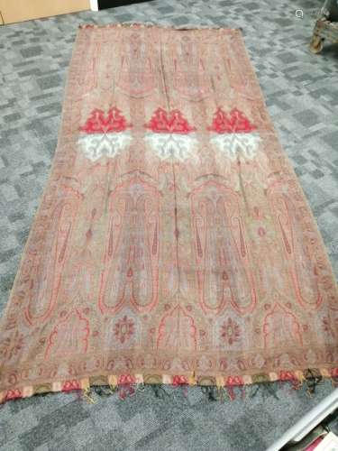 A 19th Century paisley shawl, on a sage ground with a profusion of scrolling and geometric shapes,