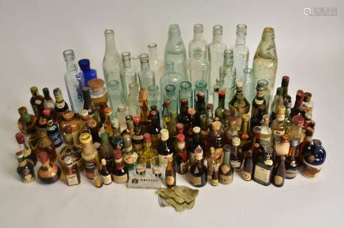 A collection of alcoholic miniatures to include Gordon's Whisky, Gordon's Gin, Martini Dry, and