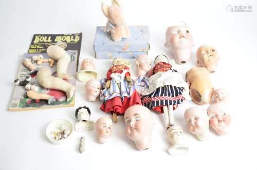 A quantity of Edwardian and later continental bisque dolls heads, eyes and limbs mostly for