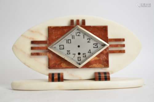 A French Art Deco mantel clock, in red and white marble, silvered face with Arabic numerals and a