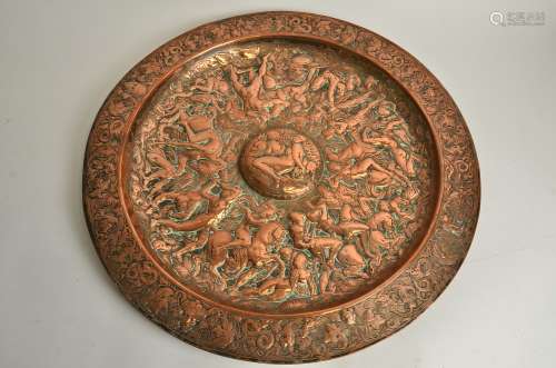 A mid 19th Century copper charger, The Battle of the Amazons', the central roundel with nude