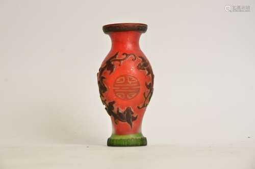 A Chinese red cameo glass vase, with encircling dragons and shou characters, height 15cm