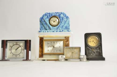A collection of five Art Deco mantel clocks, comprising two in chromed metal, one in marble, another