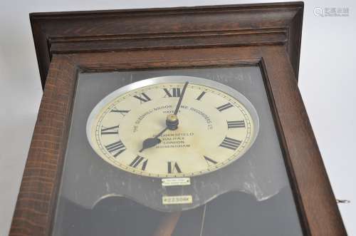 A Gledhill-Brook time recorders ltd clocking in clocking out patent clock, in a wooden case, with