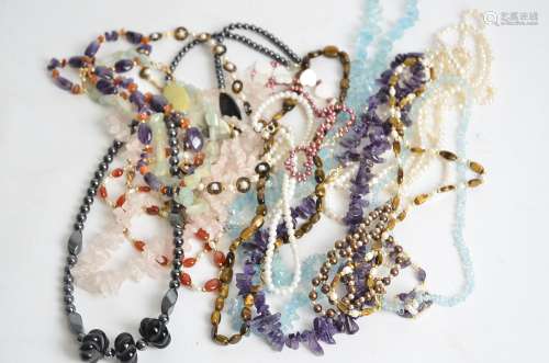 A quantity of costume jewellery, to include hardstone and seed pearl necklaces to include rose