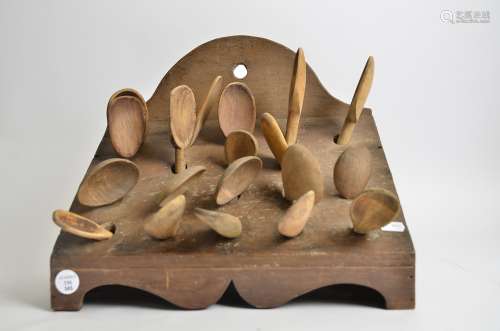 A 19th Century or early 20th Century pine spoon rack, with four tiers and nineteen assorted wooden