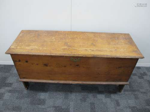 An antique boarded coffer, moulded top, arched end boards, candle box to the interior, 118cm x