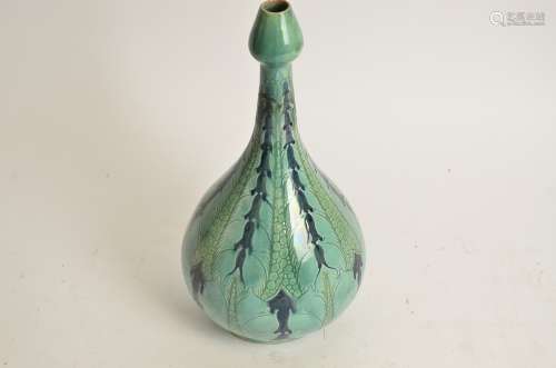 Della Robbia Pottery (Birkenhead 1894-1906), a bulbous vase terminating in a tulip shaped neck, with