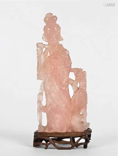 A Chinese rose quartz figure, probably Guanyin, height 23cm, together with a wooden stand, a/f