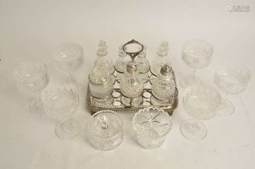A seven part cruet set on plated stand, with a Georgian pierced silver lid, hallmarked for Sheffield