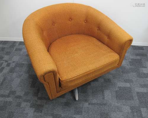 A mid- century swivel tub chair, possible Danish design, orange upholstery with buttons to the back,