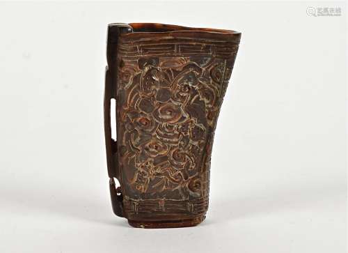 A Chinese horn libation cup, each side with multiple mythical beasts, probably mid 20th Century