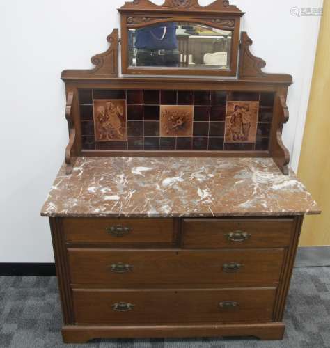 An Edwardian walnut tiled backed wash stand, two short over two long drawers to base, panelled