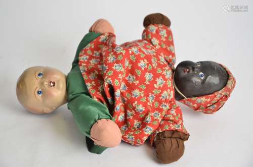 A 20th Century child's reversible doll, approximate length 40cm