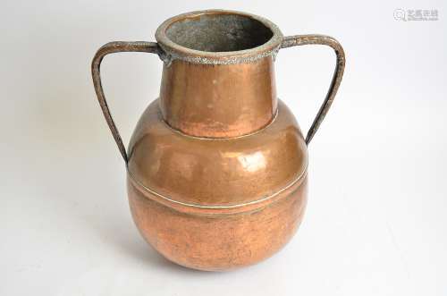A large twin handled copper vessel, of globular form, height 40cm