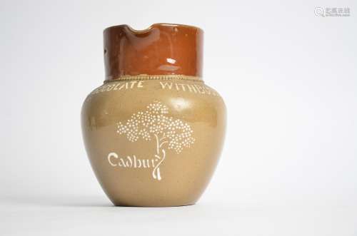 A stoneware Cadbury advertising jug, with the motto 'make drinking chocolate with Bourneville