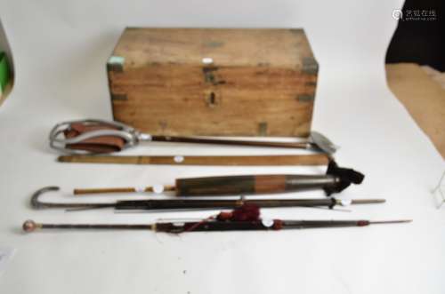 A early 20th Century small pine campaign style trunk, together with a shooting stick and