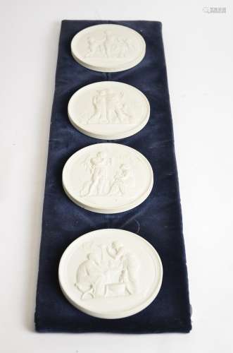 Four Royal Copenhagen bisque roundels with classical subjects, width 14cm, all hung on a mount, 69cm
