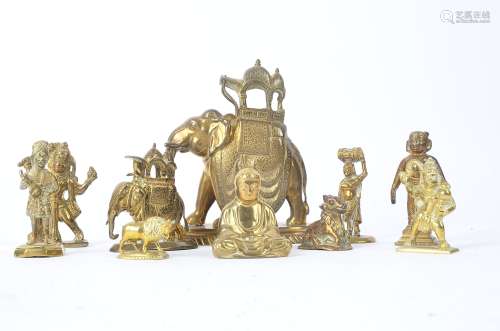 A brass study of an elephant carrying a howdah, raised on a rounded lozenge shape base, height 15.
