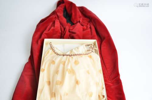 A vintage red femme fatale style satin cape, with original label Estrava of London, together with