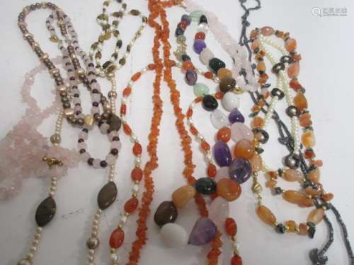 Several hardstone and seed pearl necklaces, to include tigers eye and mixed pebble stone