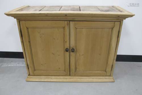 A 19th century wax pine two door cupboard, panelled doors and sides, two shelfs to the interior,