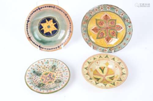 Della Robbia Pottery (Birkenhead 1894-1906), three small shallow earthenware dishes together with