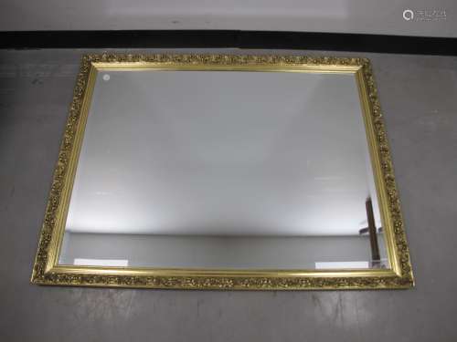 A rectangular gilt framed wall mirror, with bevelled plate, 103cm x 87cm