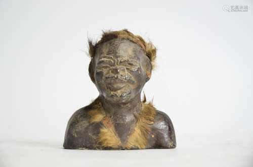 A Zulu ceramic figure with animal fur and beadwork adjournment, height 10cm