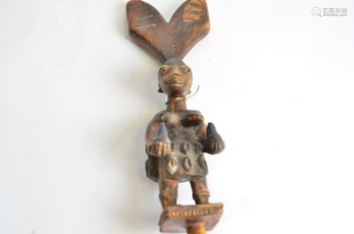 A Yoruba Shango wand, with female figure, length 55.5cm