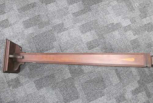 An Art Nouveau mahogany inlayed torche, tapering column with reeded edges, on square stepped base,