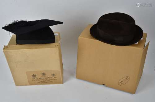An Ede & Ravenscroft mortar board, the square academic cap with central tassel marked 7 1/2, 58,