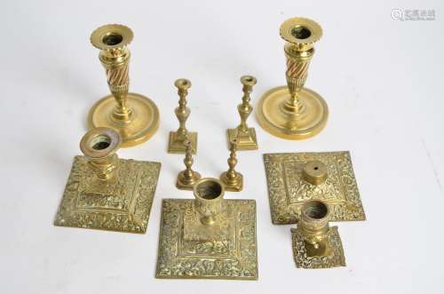 A small group of 19th Century and later candlestick holders, including two pairs, one brass and