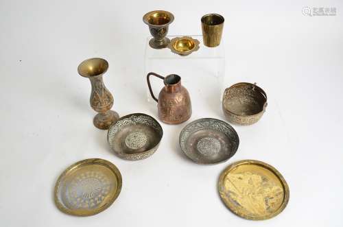 A small quantity of Middle Eastern metal ware, including a pair of copper bowls with repousse floral