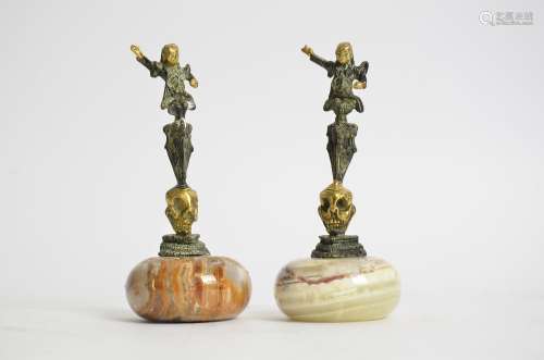 A pair of Chinese gilt metal bronzes raised upon onyx bases, height 14cm