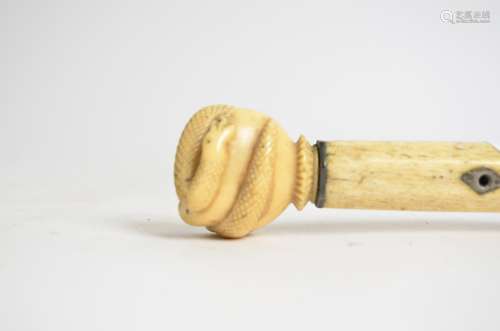 A Victorian carved ivory walking stick, taking the form of a hand grasping a coiled snake, length
