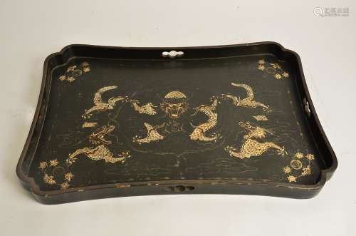 A Chinese lacquer tray, with confronting dragons chasing the flaming pearl, 58cm x 37cm a/f