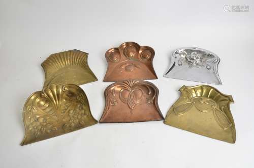 Six early 20th Century metalwork crumb trays, all with stylised floral or geometric designs, 24cm