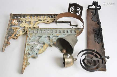 A Victorian shop's door bell and bell pull, together with a pair of cast iron wall brackets and