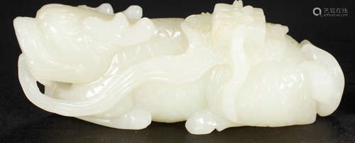 A HETIAN JADE CARVED BEAST SHAPED PENDANT