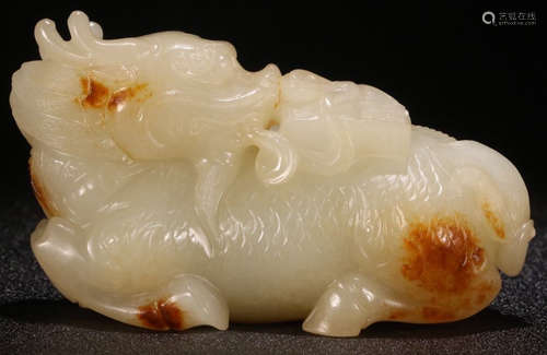 A HETIAN JADE CARVED QILIN BEAST SHAPED PENDANT