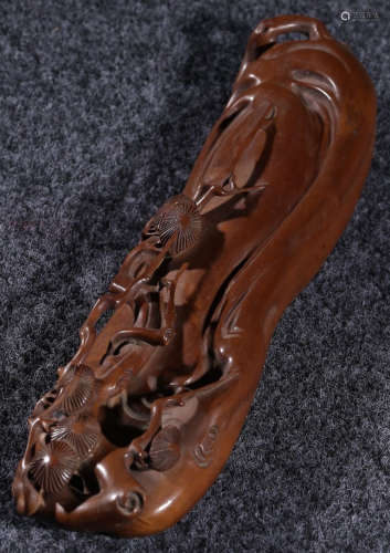 A HUANGYANG WOOD CARVED PAPERWEIGHT