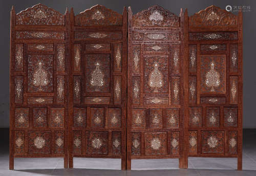A TANXIANG WOOD CARVED FLORAL PATTERN SCREEN
