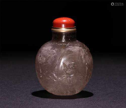 A CHINESE CARVED SMOKY QUARTAZ SNUFF BOTTLE