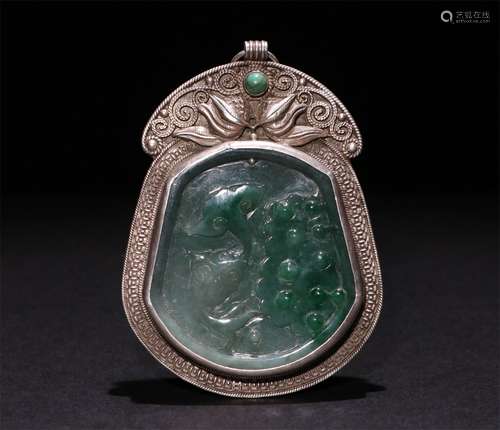 A CHINESE CARVED JADITES COVERD SILVER PENDANT