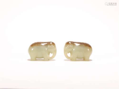 A PAIR OF CHINESE CARVED HETIAN JADE ORNAMENTS