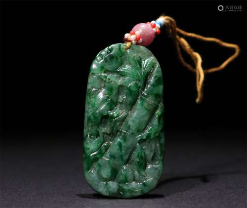 A CHINESE CARVED JADITES PENDANT