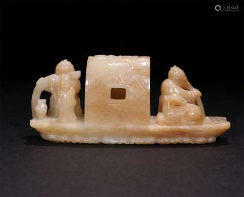 A CHINESE CARVED HETIAN JADE ORNAMENT